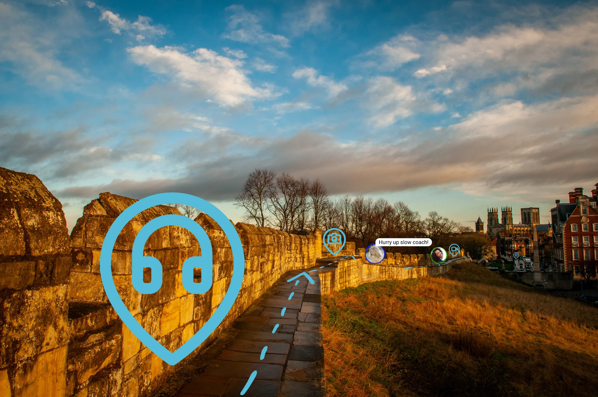 A GuideMapp guide pin and route overlaid on a photograph of the York city walls.